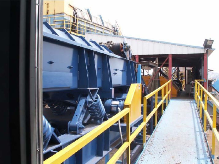 Conveyor system in a manufacturing facility with the Vibra-sync remote stroke monitoring device attached, measuring equipment vibration and movement.